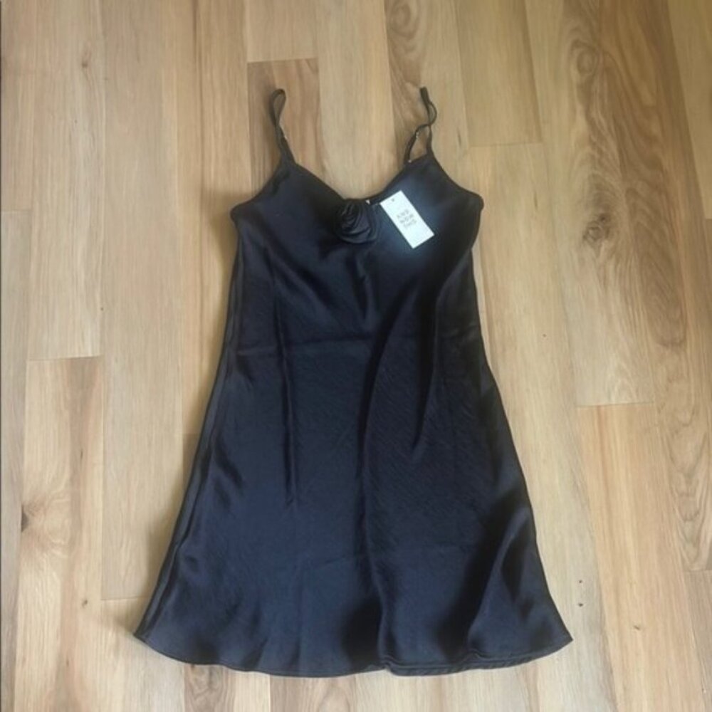 And Now This Black Silky Chemise with Spaghetti Straps and Flared Hem